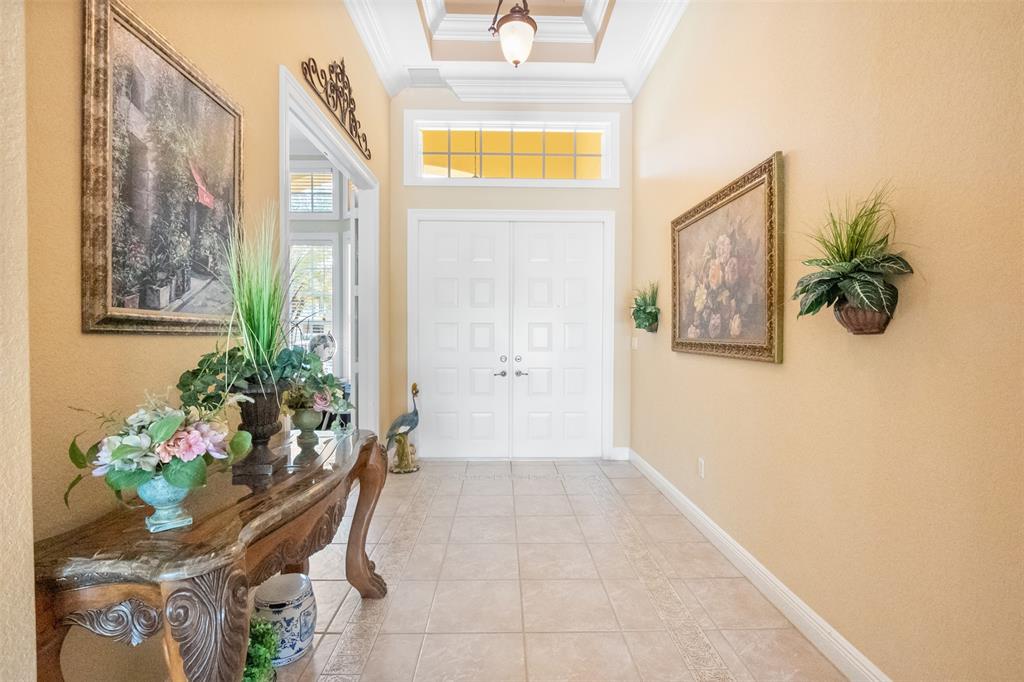 3462 Dovecote Meadow Lane Davie, FL 33328 - Photo 3 of 40 a view of a hallway with furniture and a potted plant