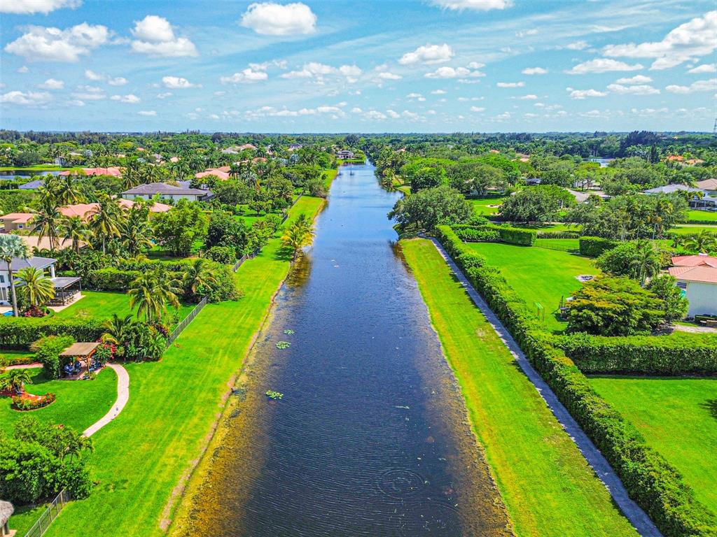 3462 Dovecote Meadow Lane Davie, FL 33328 - Photo 36 of 40 a view of a yard with an ocean