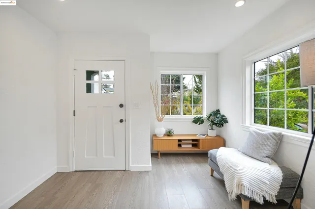 a living room with furniture and windows