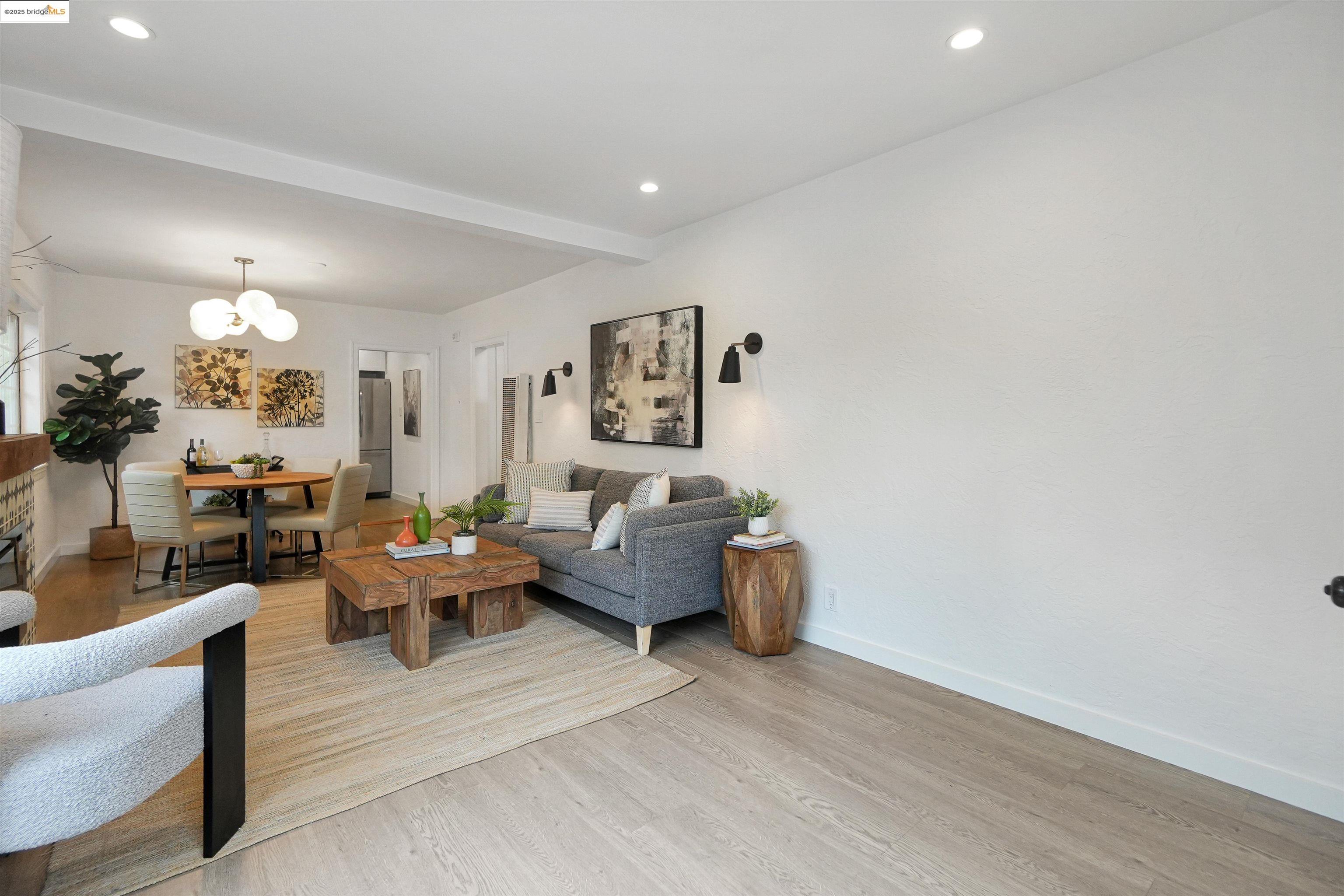 3911 Vale Avenue Oakland, CA 94619 - Photo 15 of 45 a living room with furniture and a chandelier
