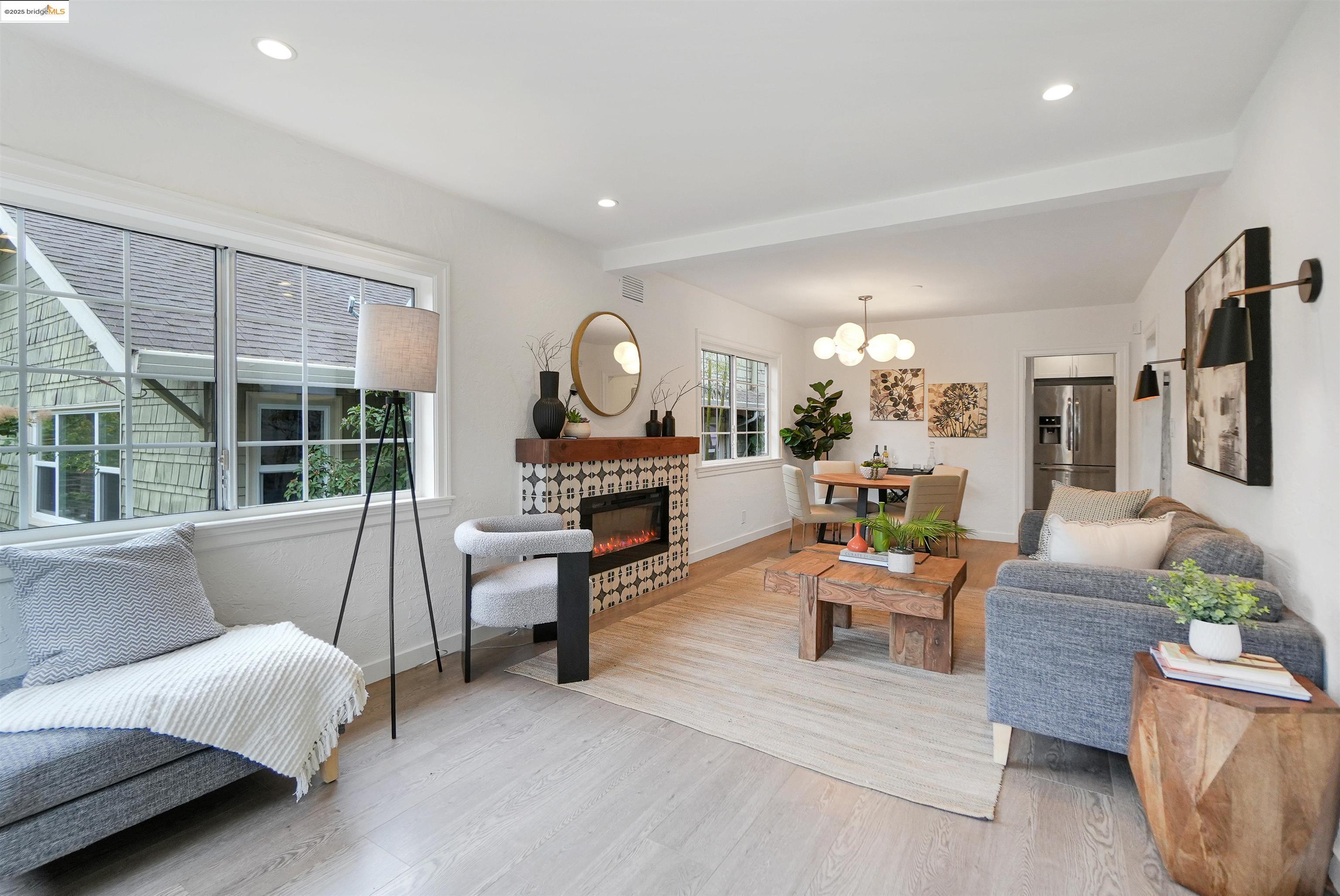 3911 Vale Avenue Oakland, CA 94619 - Photo 2 of 45 a living room with furniture and a large window