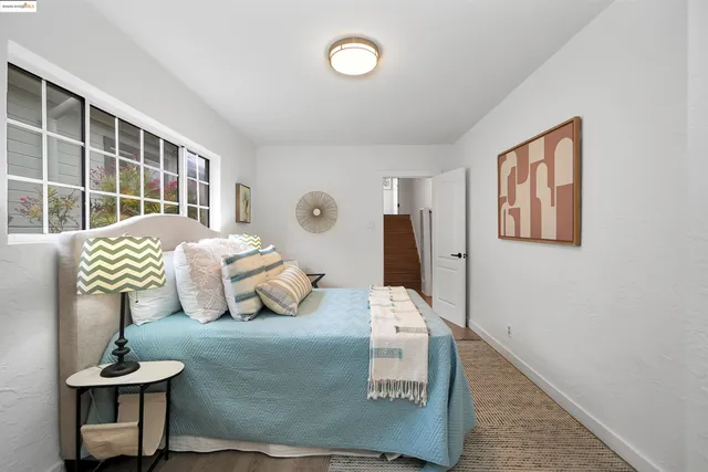 a bedroom with furniture and a window