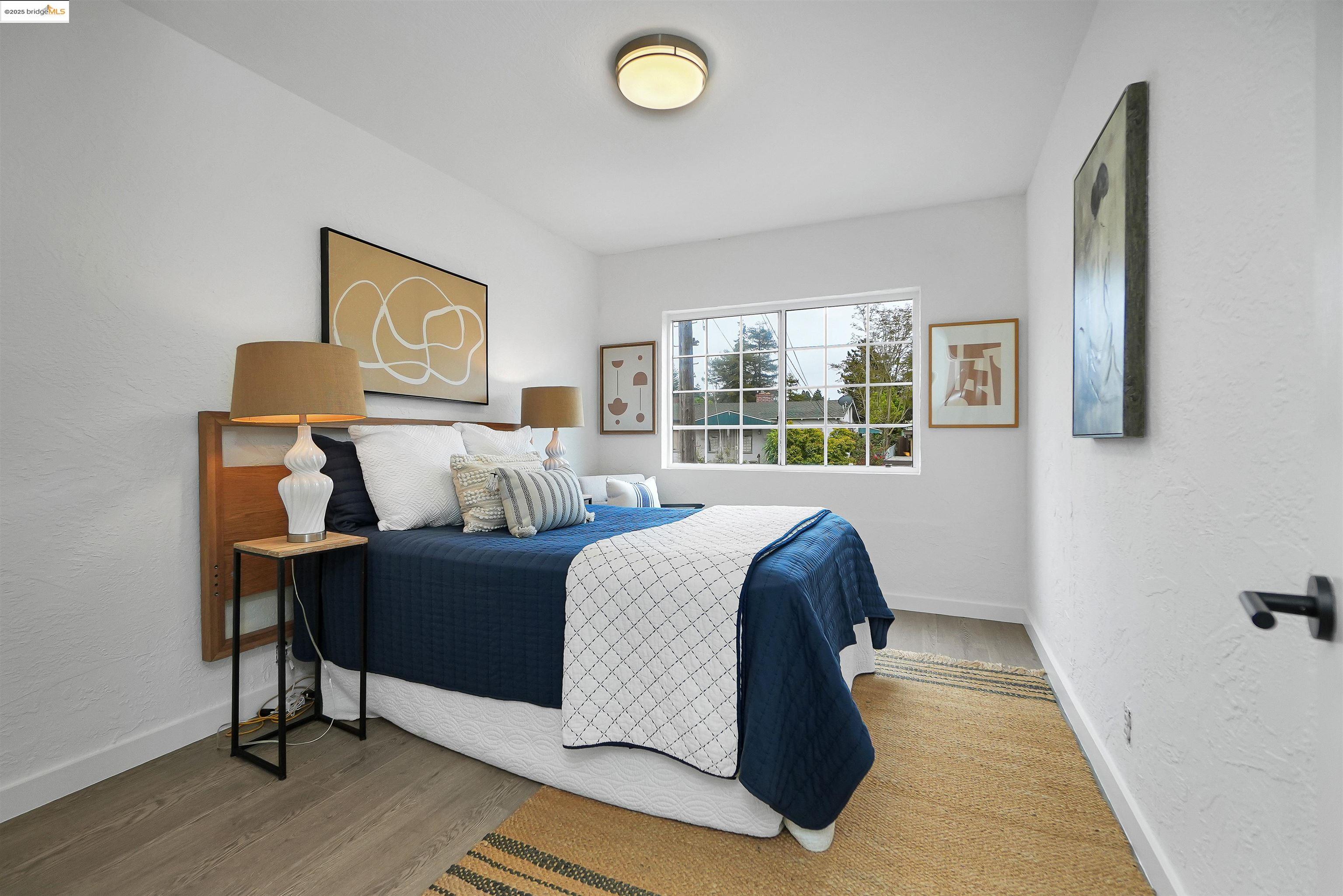 3911 Vale Avenue Oakland, CA 94619 - Photo 29 of 45 a bed room with a bed and a window