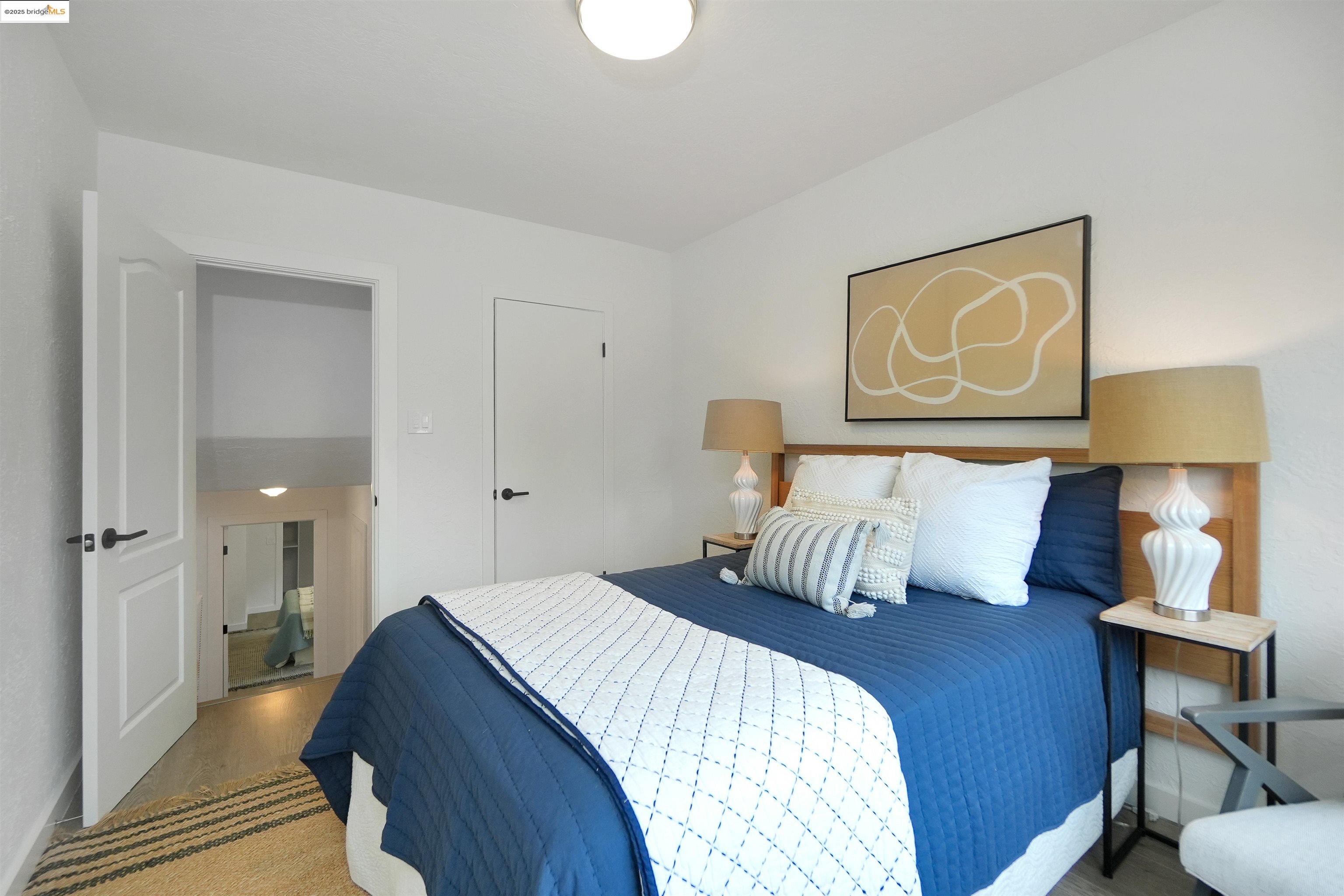 3911 Vale Avenue Oakland, CA 94619 - Photo 30 of 45 a bedroom with a bed and lamp