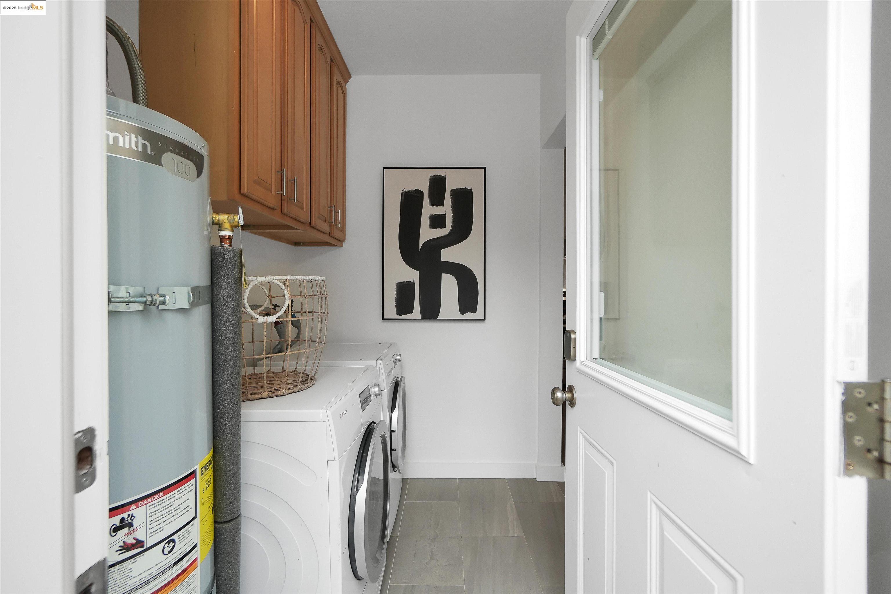 3911 Vale Avenue Oakland, CA 94619 - Photo 31 of 45 a view of storage and utility room with refrigerator
