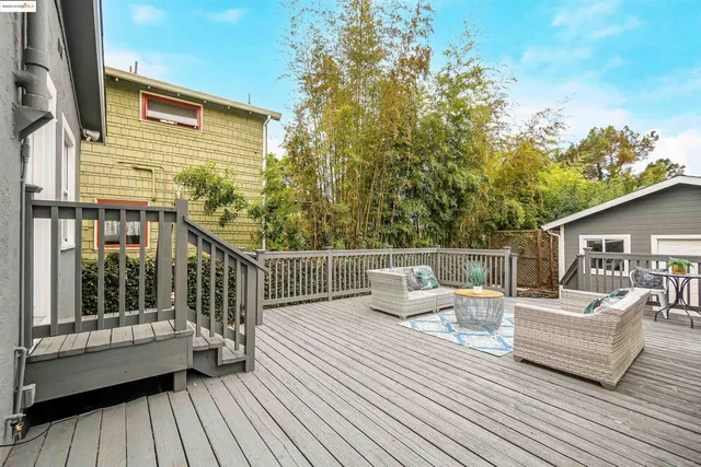 a balcony with furniture and wooden floor