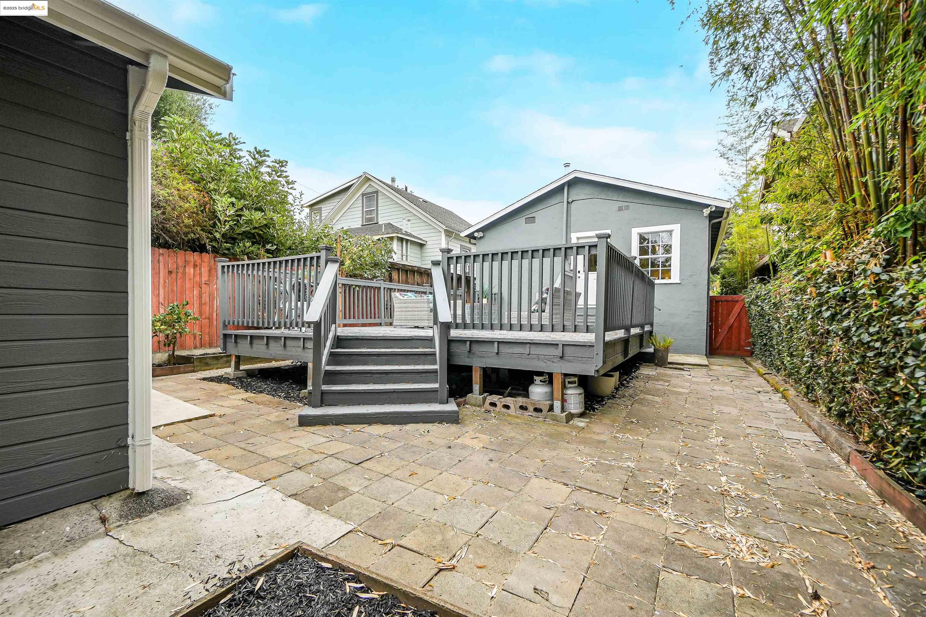 3911 Vale Avenue Oakland, CA 94619 - Photo 36 of 45 a view of backyard with deck and a garden