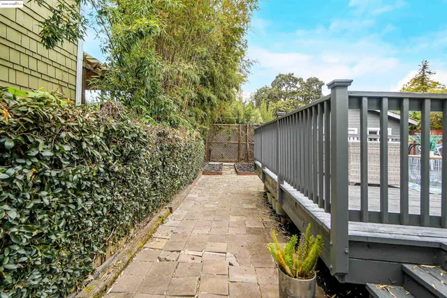 a view of a pathway with a garden