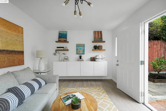 a view of living room with furniture and a window