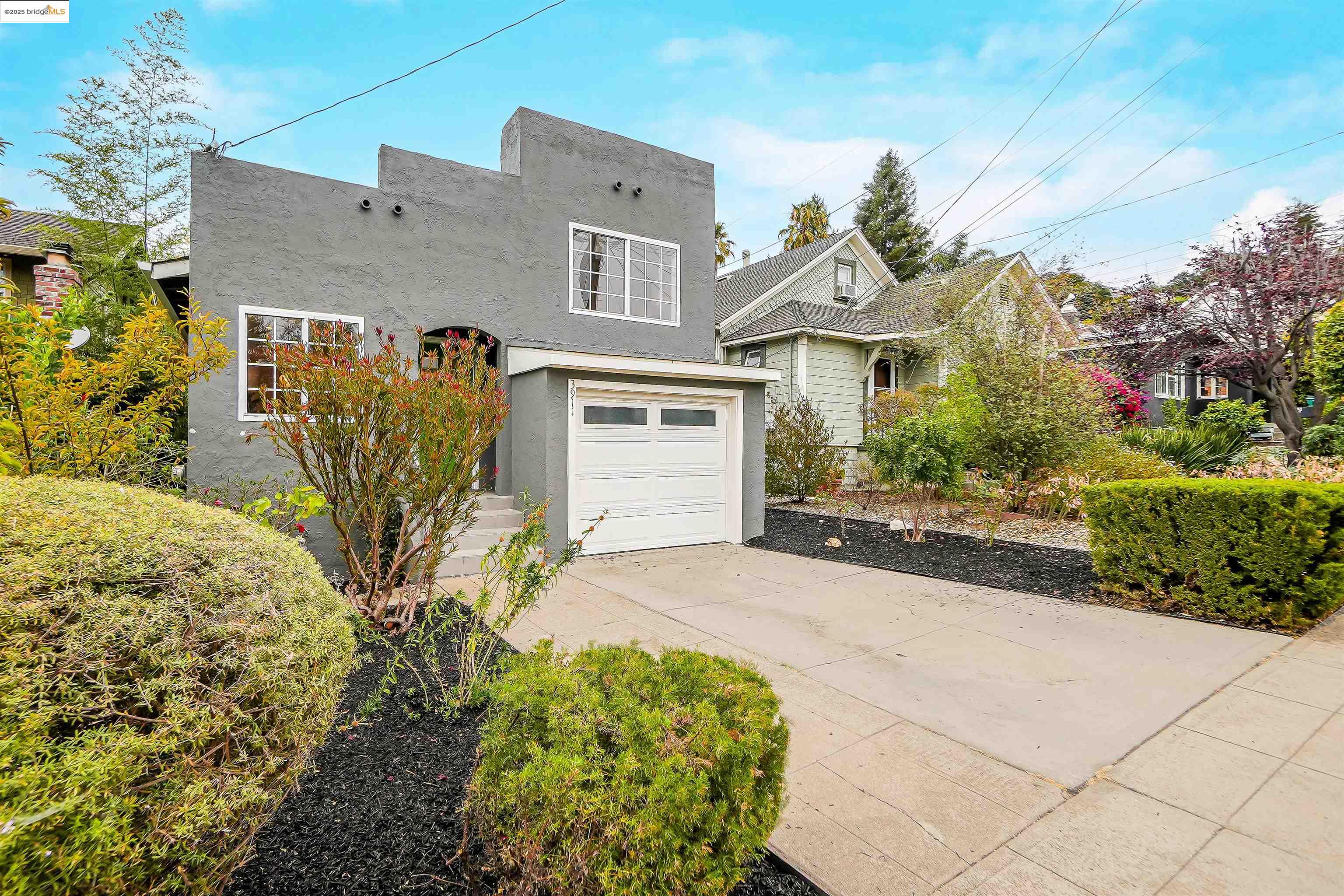 3911 Vale Avenue Oakland, CA 94619 - Photo 45 of 45 a front view of a house with garden