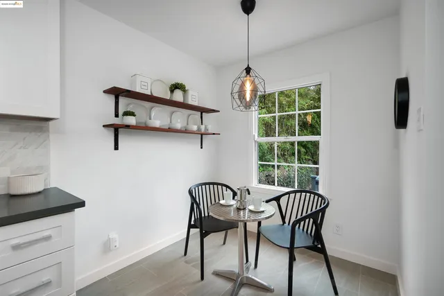 a view of a dining room with furniture window and outside view