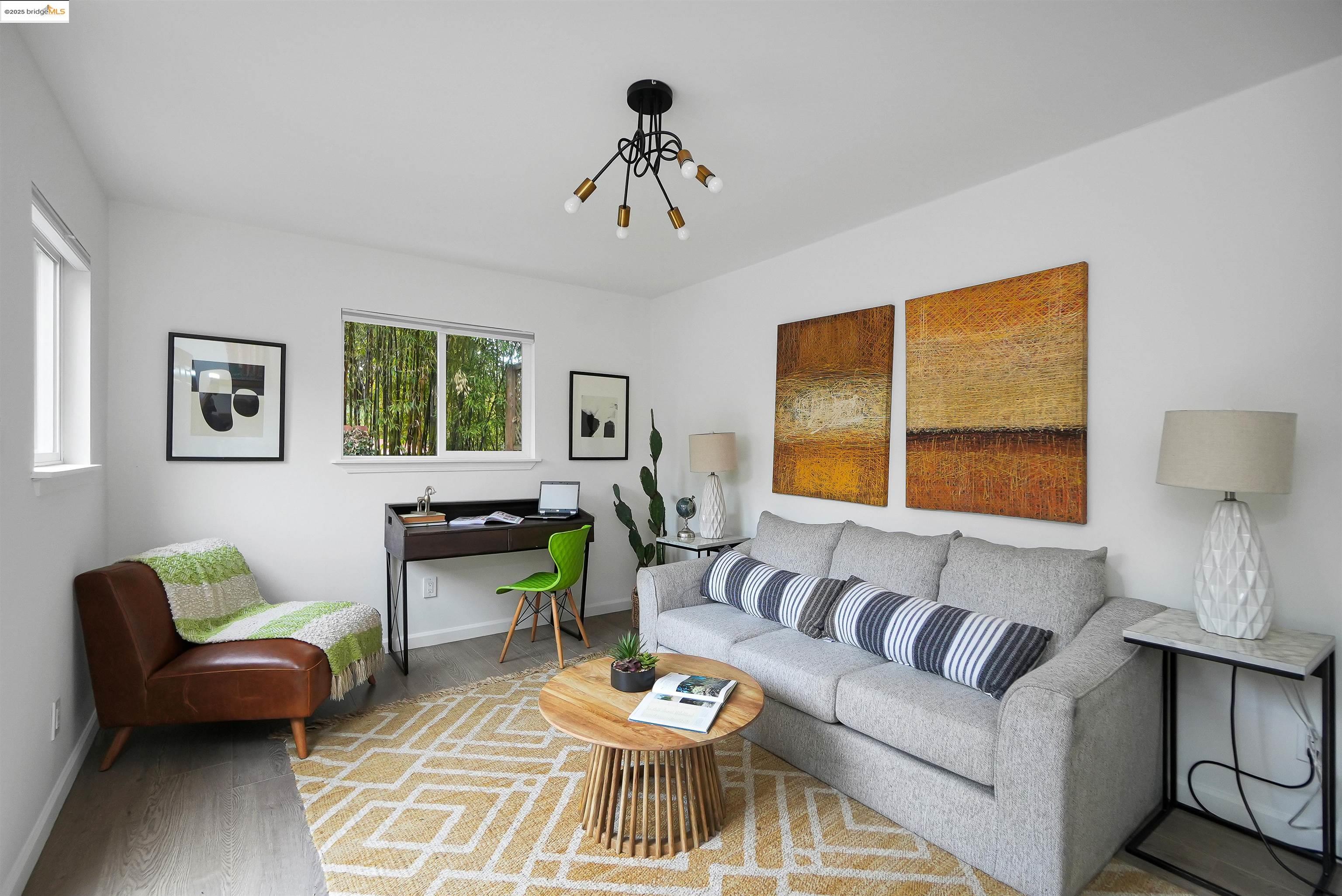 3911 Vale Avenue Oakland, CA 94619 - Photo 8 of 45 a living room with furniture and a large window