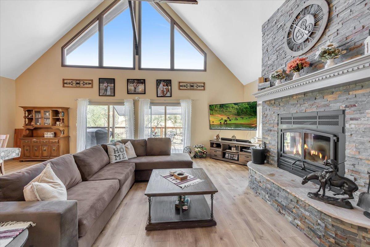 1499 Sawmill Road, Unit 594 Copperopolis, CA 95228 - Photo 18 of 98 Floor-to-ceiling stacked-stone fireplace with raised hearth, built-in wood stove and long mantle to display holiday decor and treasures.