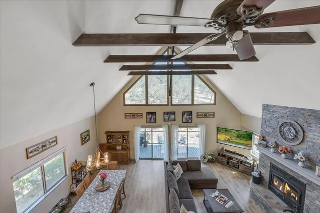 a view of a yard with wooden fence