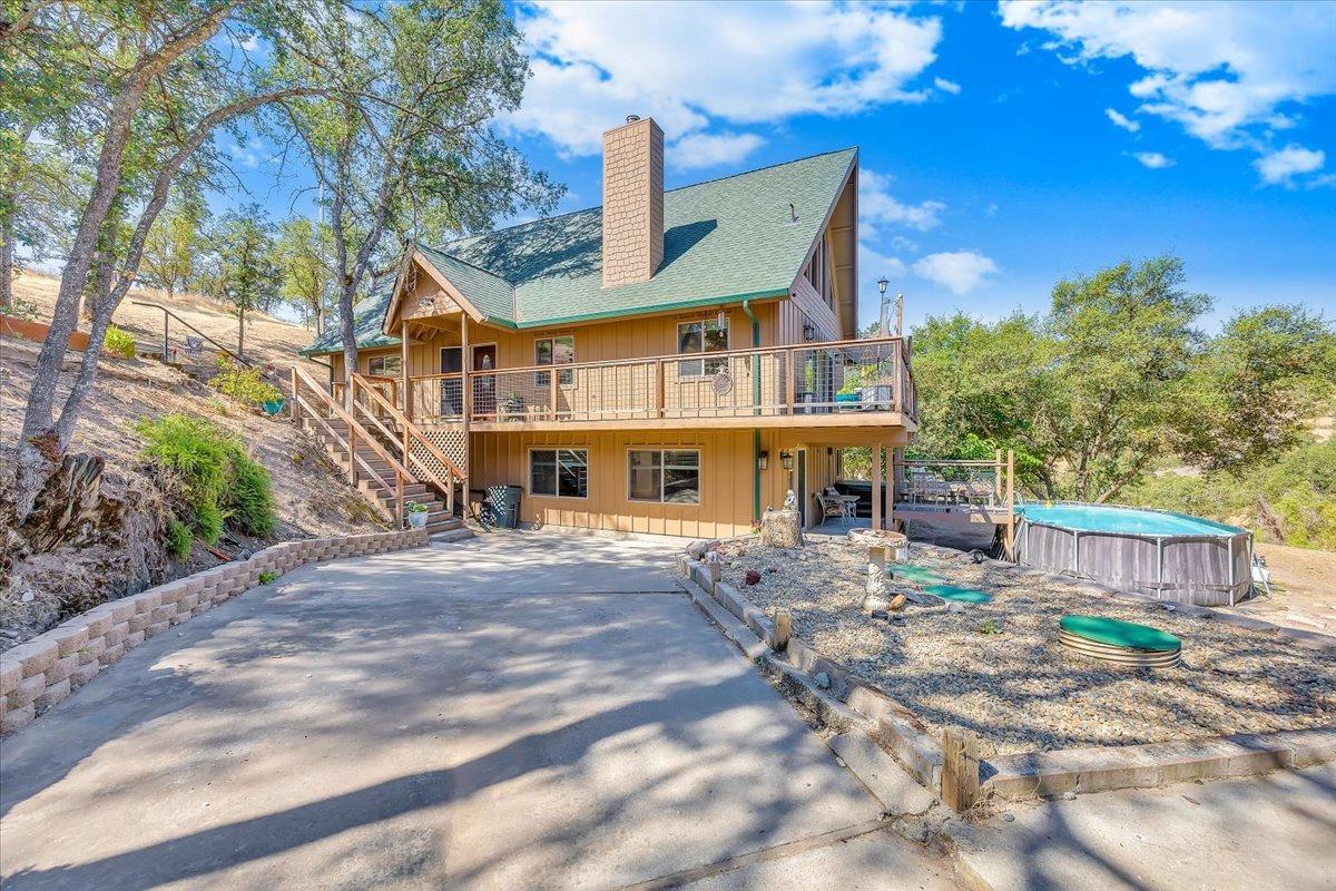 1499 Sawmill Road, Unit 594 Copperopolis, CA 95228 - Photo 8 of 98 a front view of a house with a yard