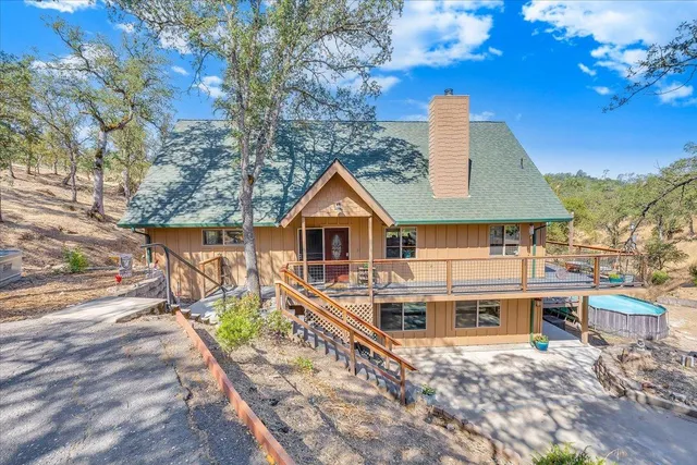 a living room with lots of furniture and a fireplace