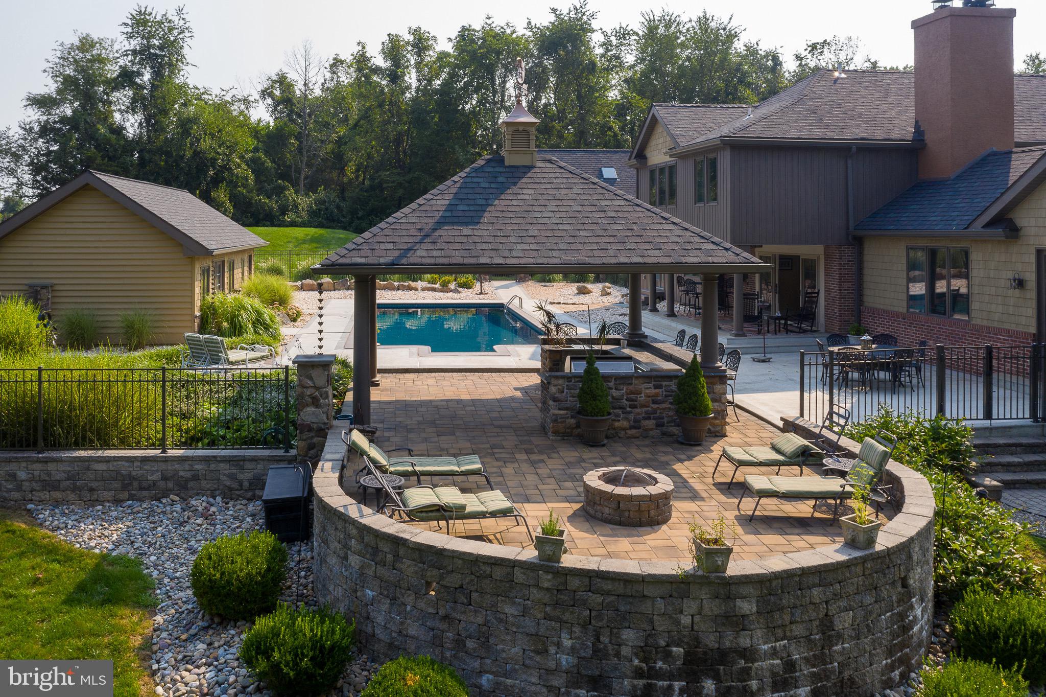 299 Woodhill Road Newtown, PA 18940 - Photo 72 of 84 Stone veranda with firepit= perfect for entertaini