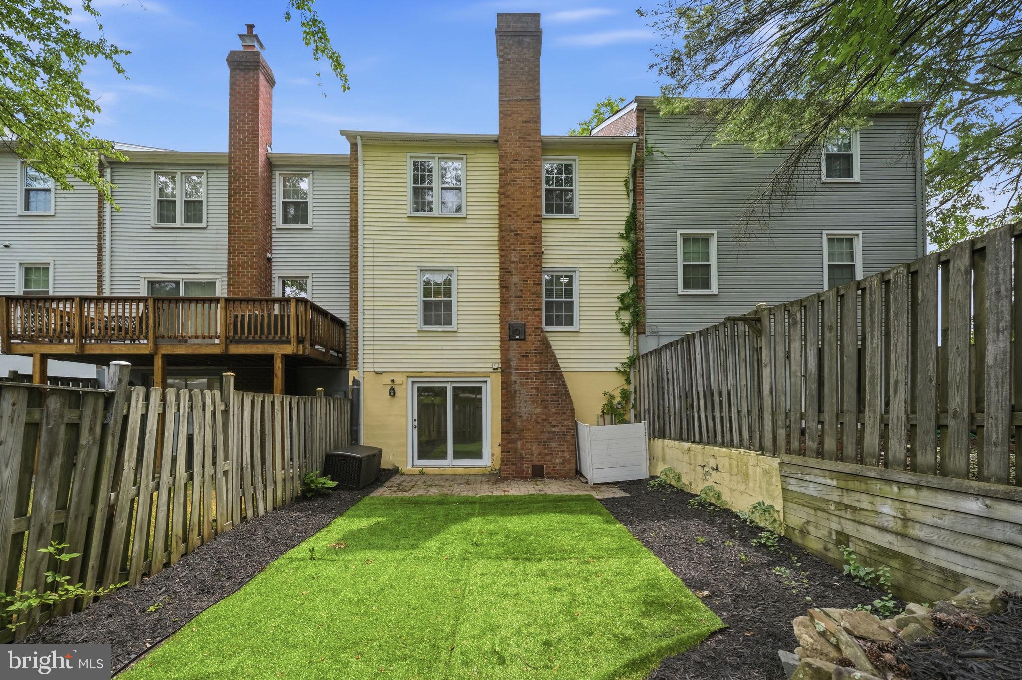 8260 Getty Court Springfield, VA 22153 - Photo 29 of 31 a front view of a house with a garden