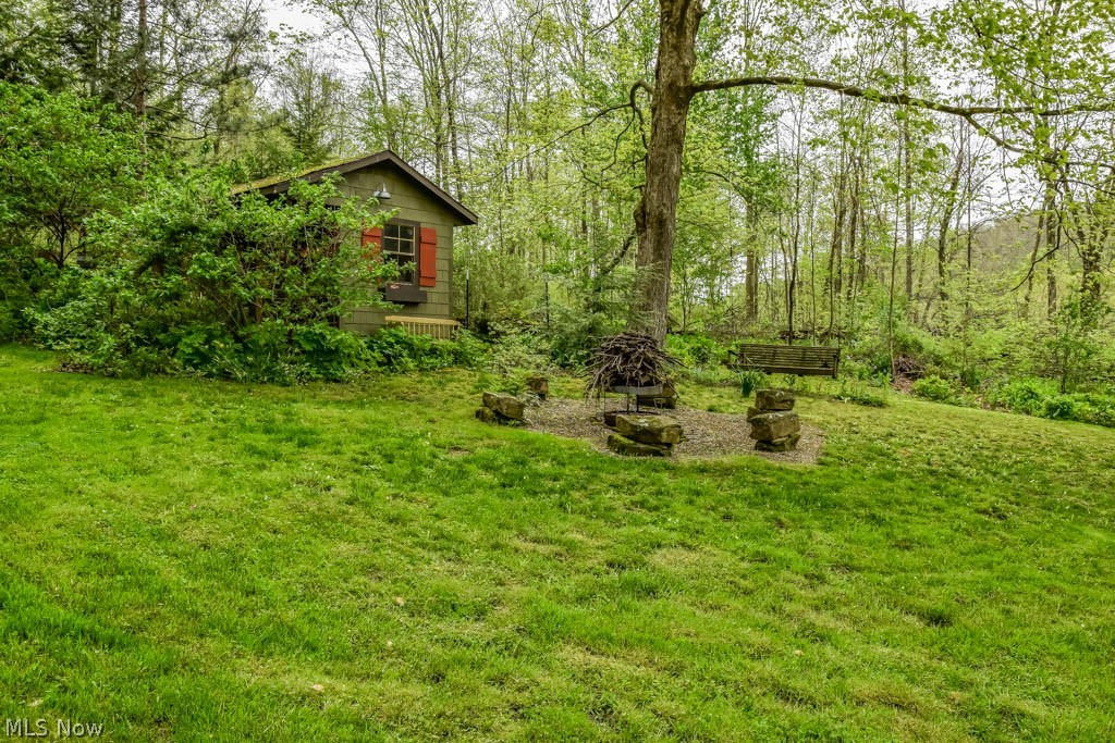 376 Bramble Road Southwest Carrollton, OH 44615 - Photo 26 of 30 Clearing with a shed and firepit.