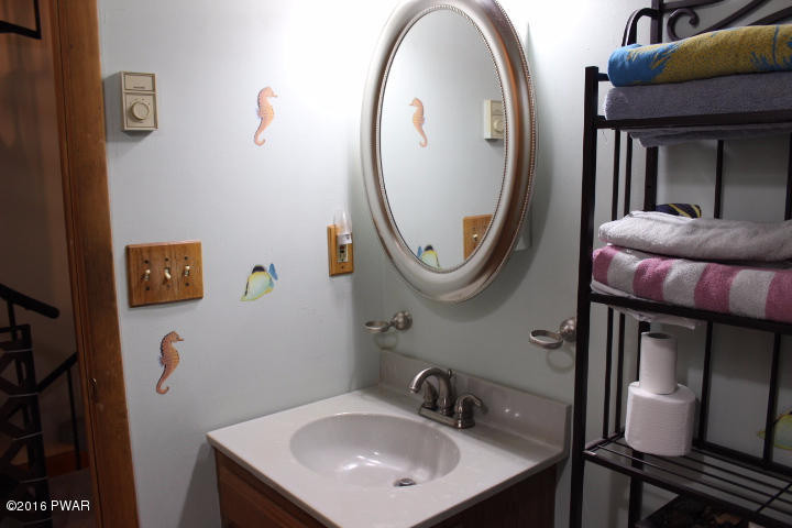 1295 Brookfield Road Lake Ariel, PA 18436 - Photo 13 of 26 a bathroom with a sink a mirror and a toilet