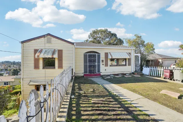 a front view of a house with yard