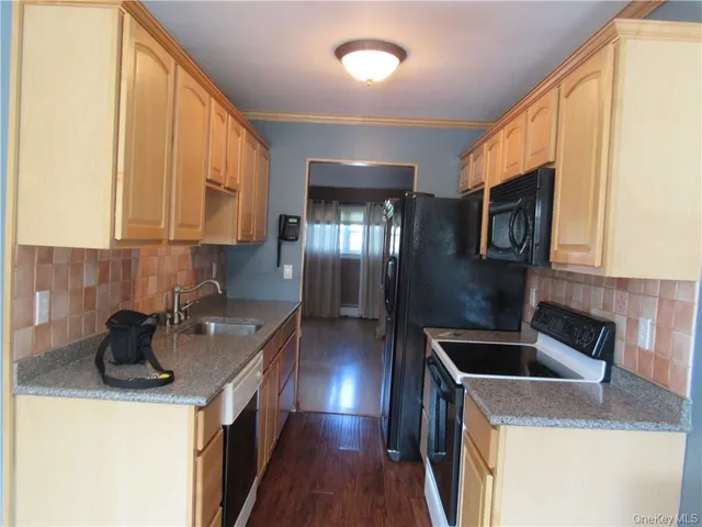 a kitchen that has a sink and a stove