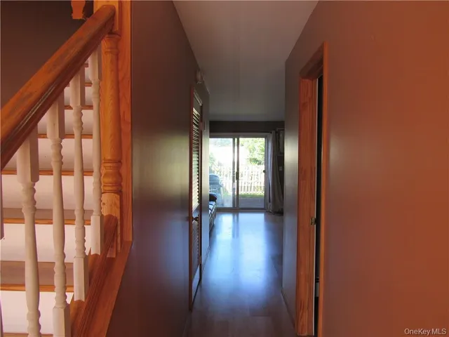 a view of gallery with wooden floor