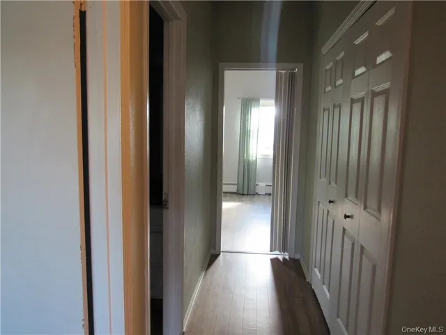 a view of a hallway with a room