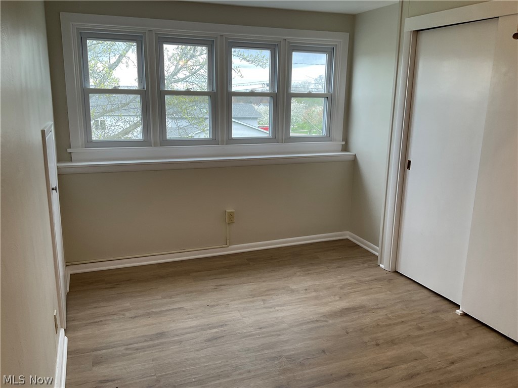 3475 South Turner Road Canfield, OH 44406 - Photo 17 of 33 Unfurnished bedroom with multiple windows and light wood-type flooring