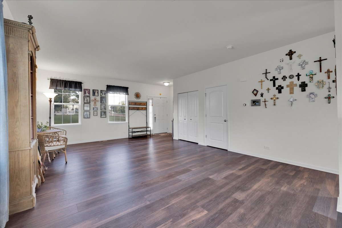 435 Fawn Lane Oswego, IL 60543 - Photo 18 of 47 wooden floor in an empty room with a window