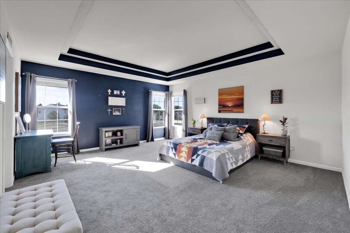 435 Fawn Lane Oswego, IL 60543 - Photo 22 of 47 a bed room with a bed and a couch