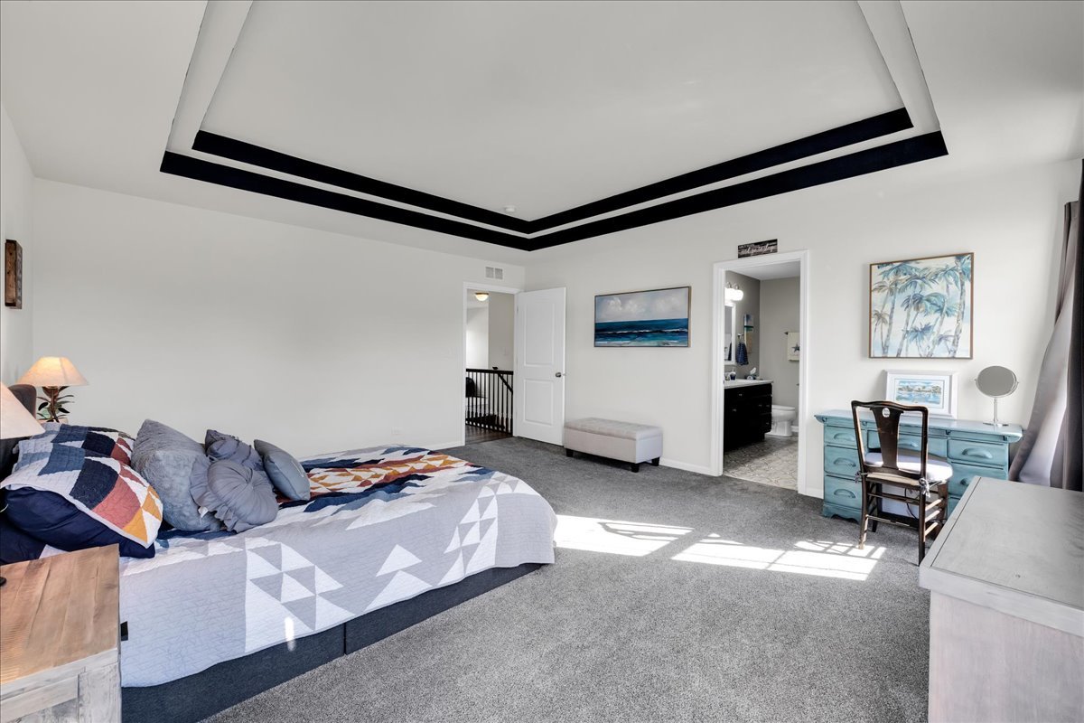 435 Fawn Lane Oswego, IL 60543 - Photo 24 of 47 a bedroom with furniture and a window