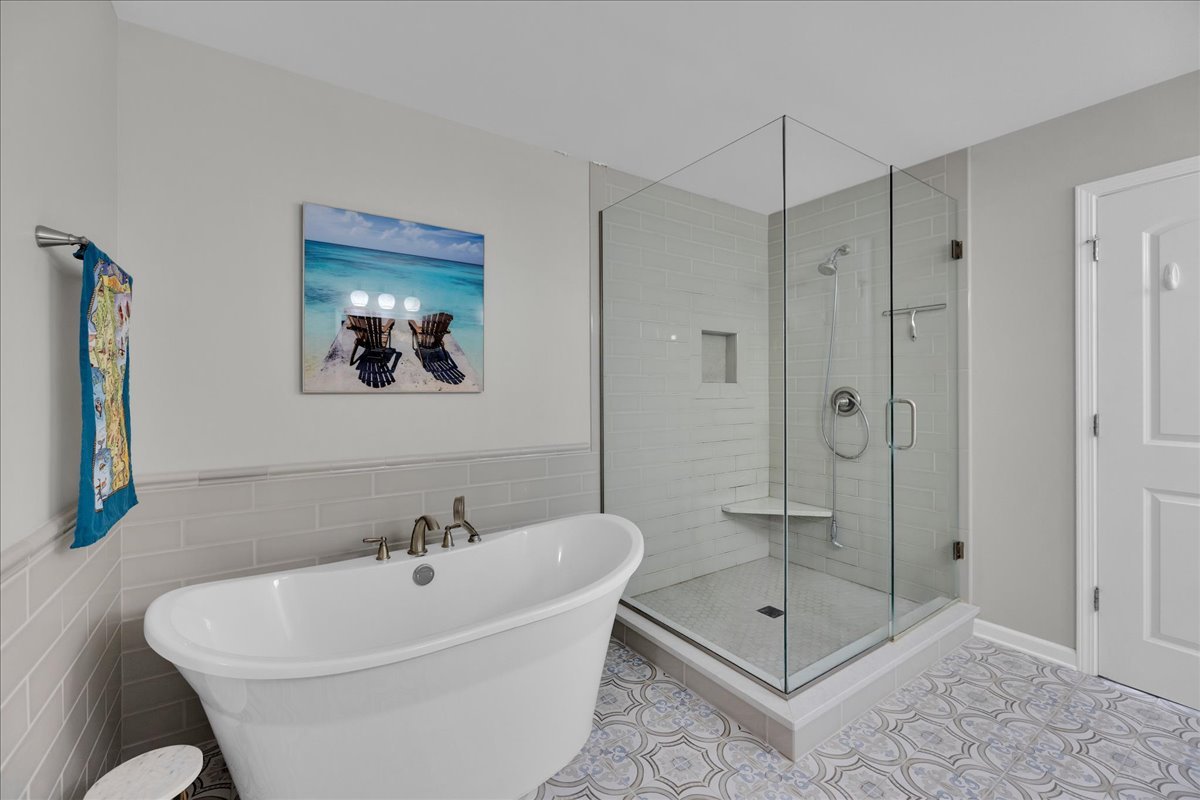 435 Fawn Lane Oswego, IL 60543 - Photo 27 of 47 a white bath tub sitting next to a bathroom shower