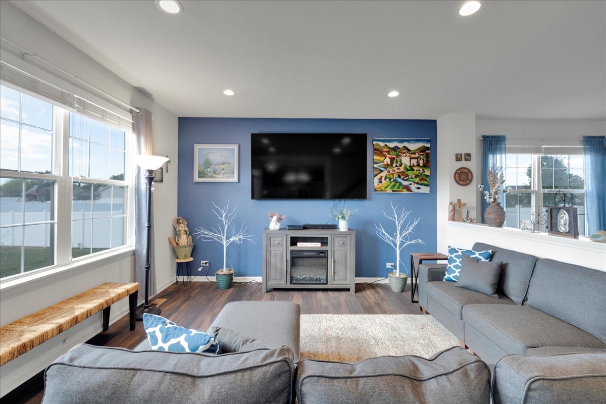 435 Fawn Lane Oswego, IL 60543 - Photo 4 of 47 a living room with fireplace furniture and a flat screen tv