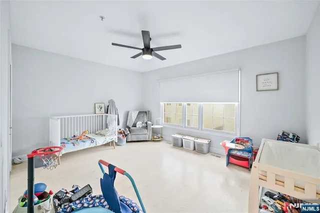 a bedroom with furniture and a chandelier