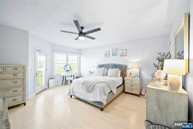 a spacious bedroom with a bed and a window