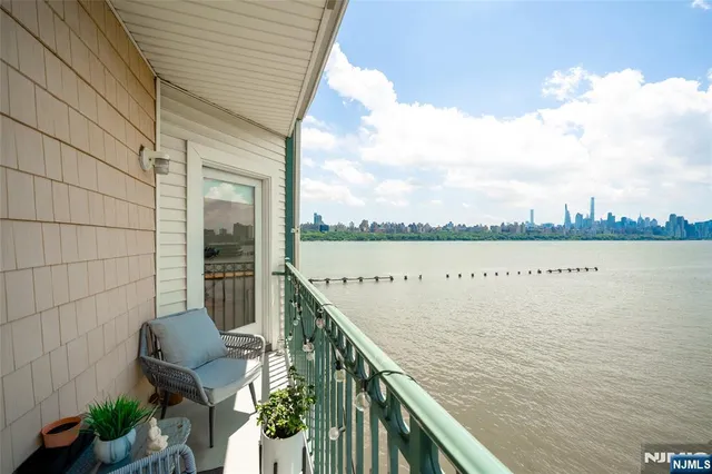 a view of a balcony with lake view and mountain view