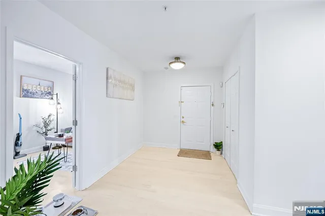 a bedroom with a bed and a potted plant