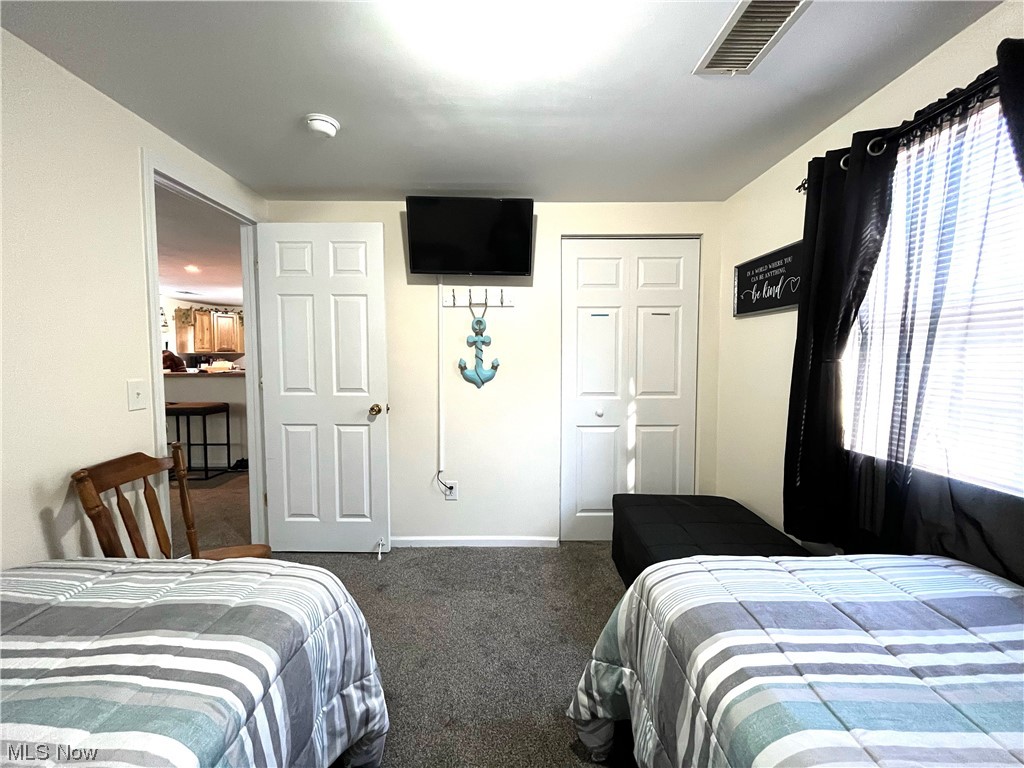 4972 West Fremont Road Port Clinton, OH 43452 - Photo 14 of 29 Carpeted bedroom featuring a closet