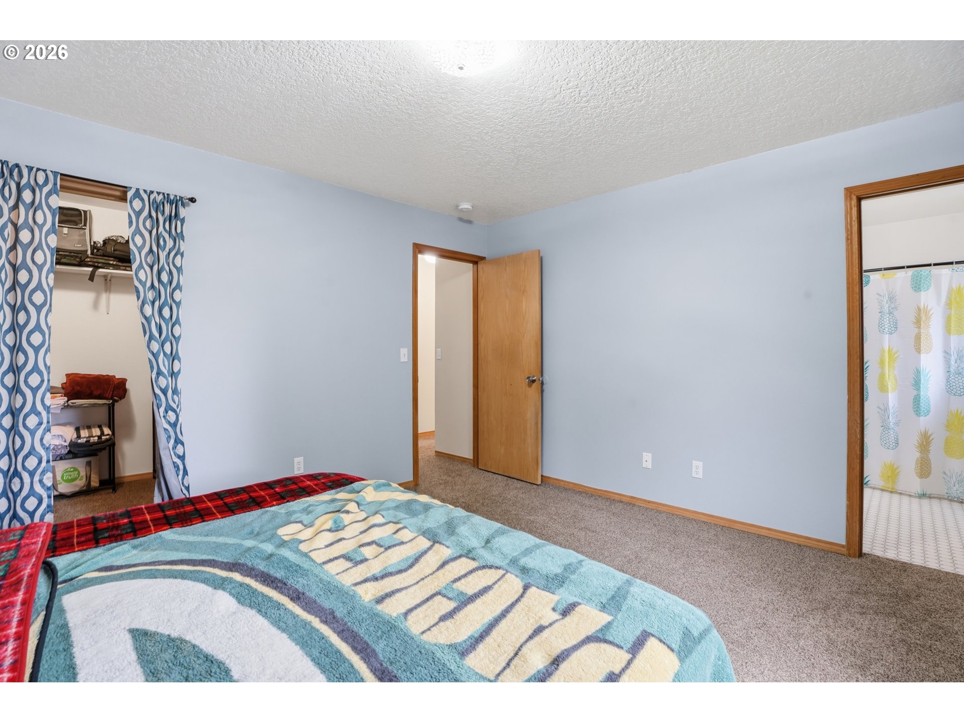 105 Toliver Road Molalla, OR 97038 - Photo 15 of 34 a bedroom with a bed and a painting on the wall
