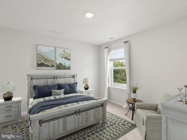 a view of a house with a backyard and chairs