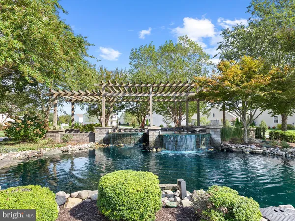 a view of a swimming pool with sitting area
