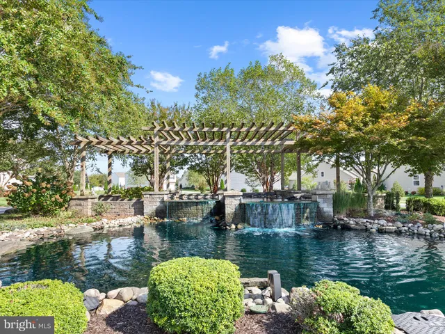 a view of a swimming pool with sitting area