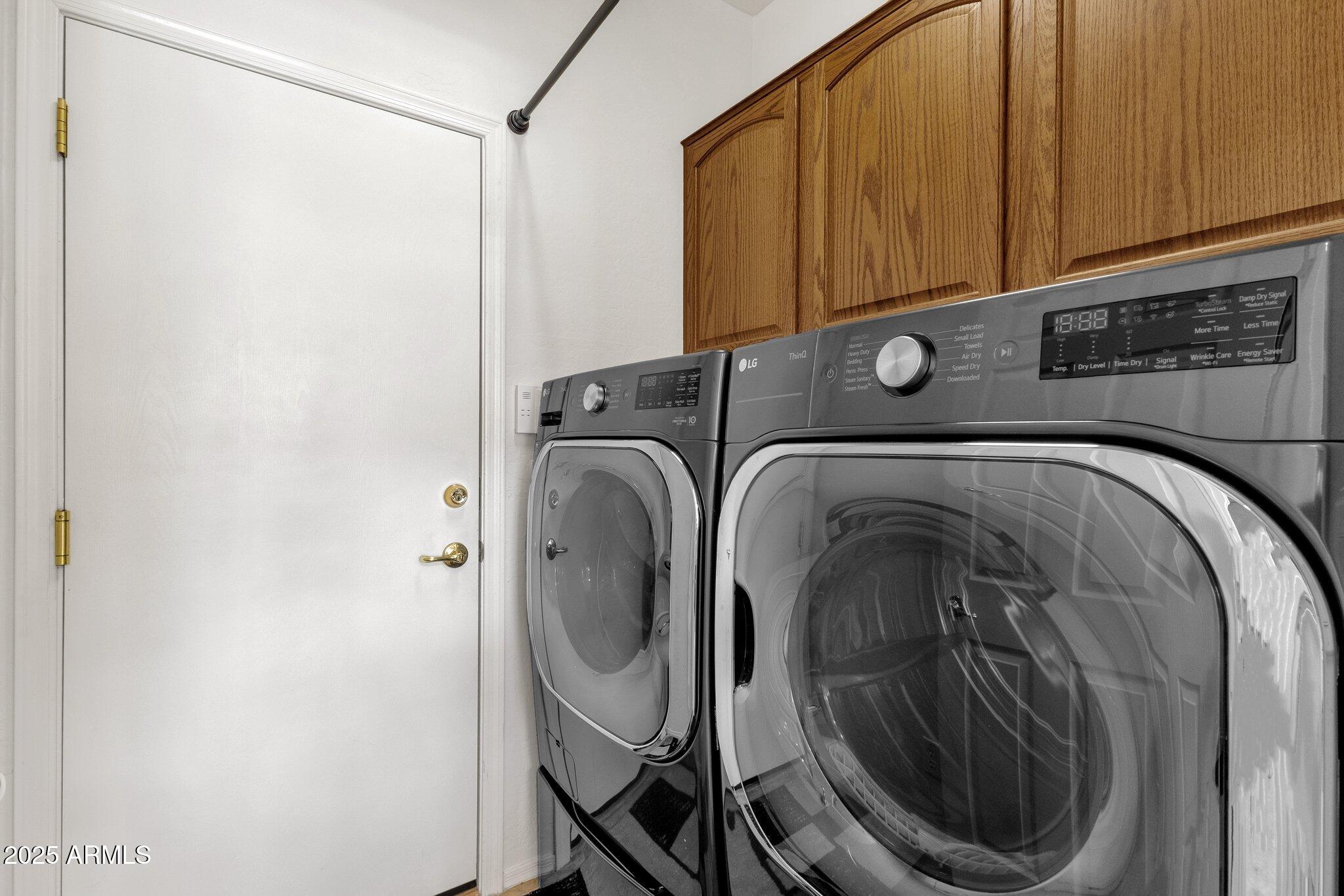 2417 West Apache Rain Road Phoenix, AZ 85085 - Photo 17 of 41 a utility room with dryer and washer