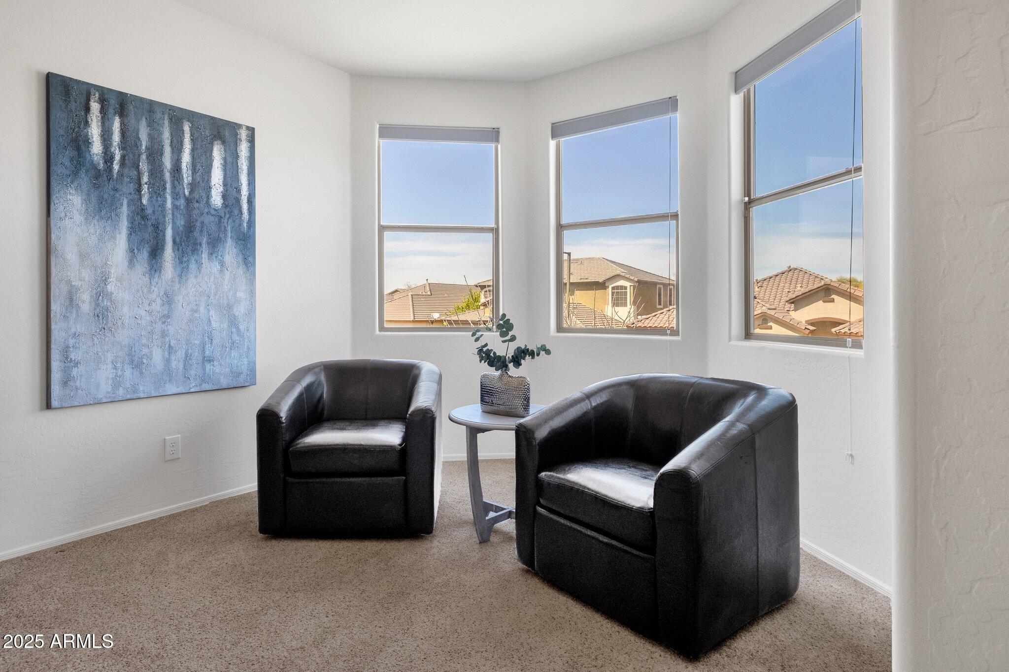 2417 West Apache Rain Road Phoenix, AZ 85085 - Photo 24 of 41 a living room with furniture and a window