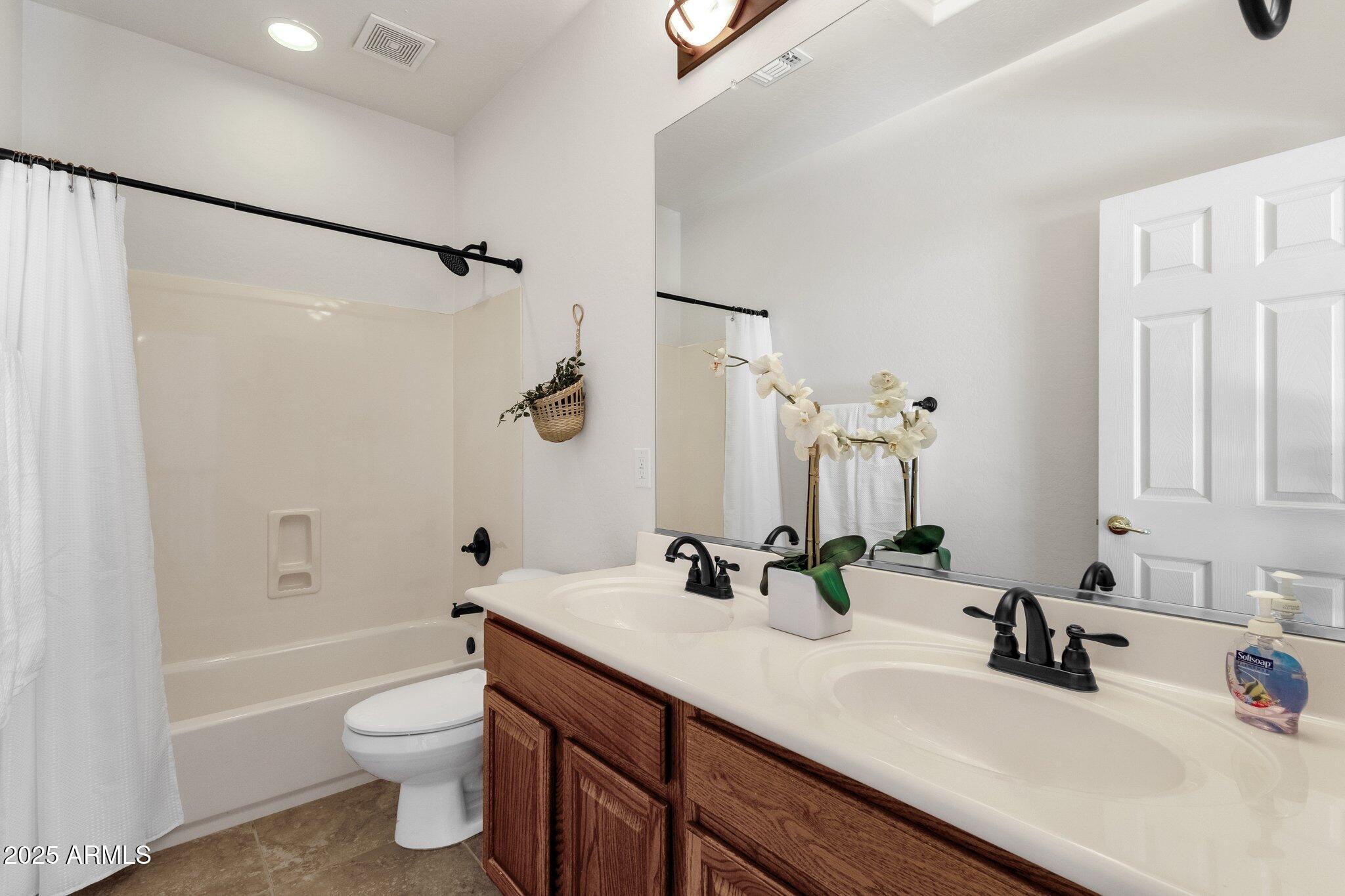 2417 West Apache Rain Road Phoenix, AZ 85085 - Photo 30 of 41 a bathroom with a sink toilet and shower