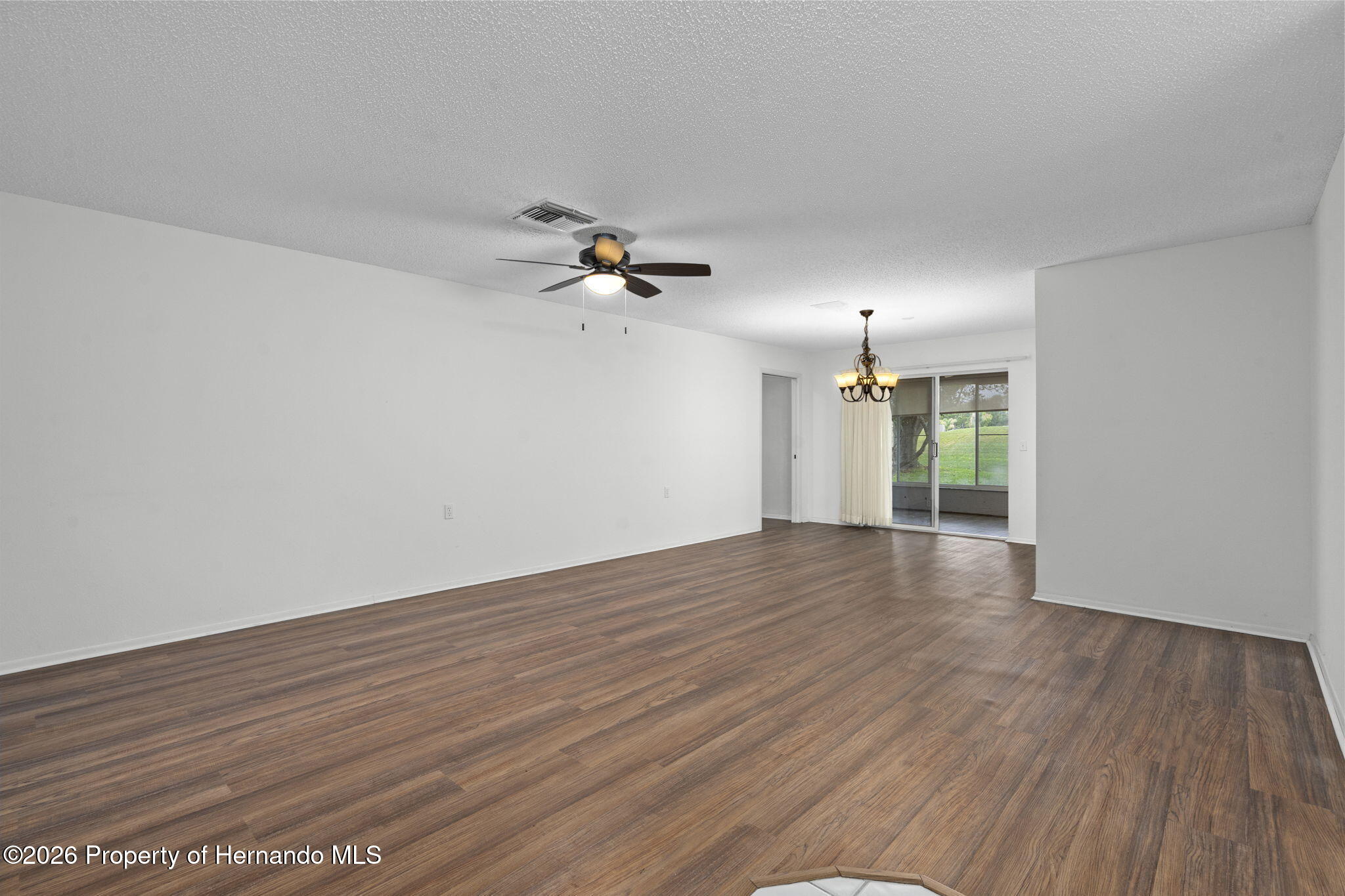 3072 Eagle Bend Road Spring Hill, FL 34606 - Photo 9 of 115 Front Entry View of Living Room/Dining Room