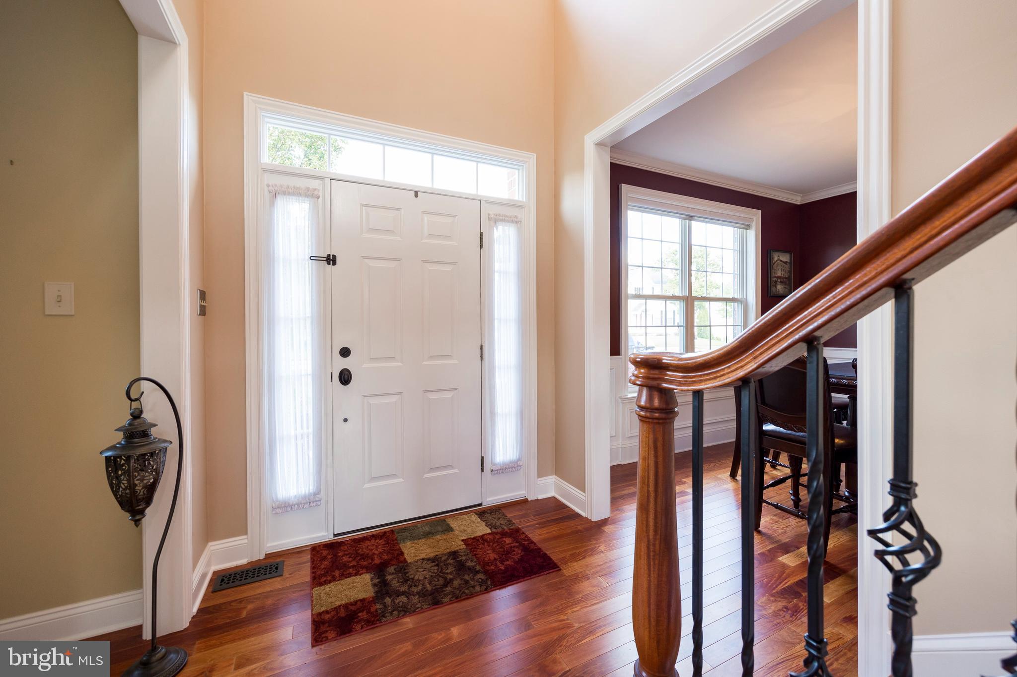 303 Doe Run Road Harleysville, PA 19438 - Photo 4 of 61 Staircase with wrought iron balusters