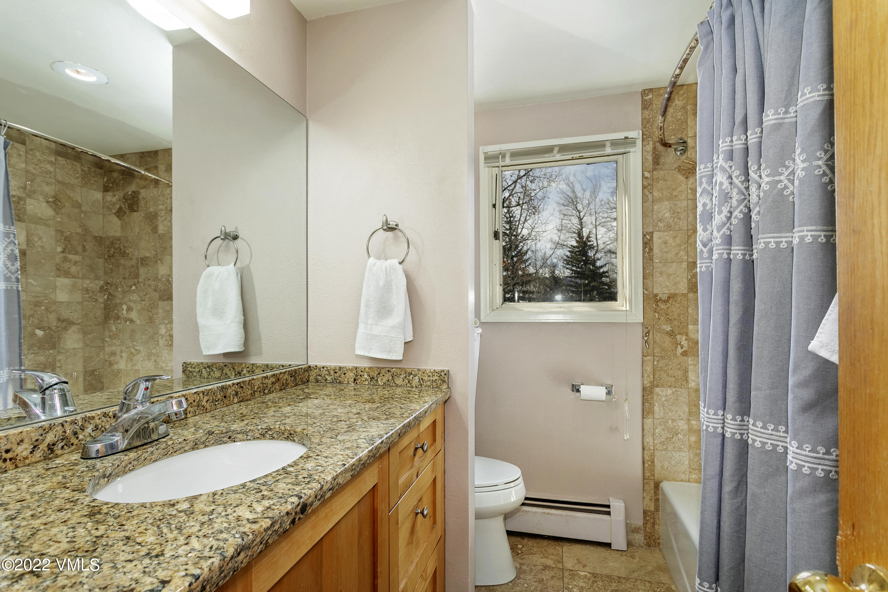1614 Buffehr Creek Road, Unit A19 Vail, CO 81657 - Photo 12 of 23 a bathroom with a granite countertop sink toilet and shower
