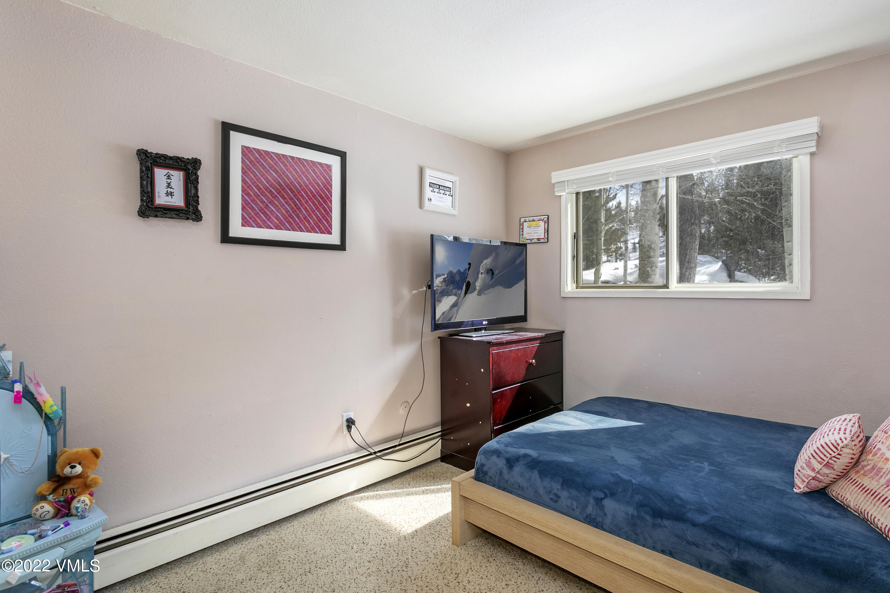 1614 Buffehr Creek Road, Unit A19 Vail, CO 81657 - Photo 13 of 23 a bed room with a bed and a window